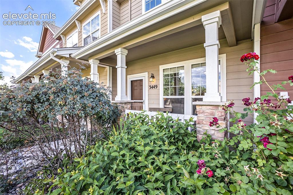 Image 2 of 24: Entry with front porch for enjoying nice Colorado mornings or evenings