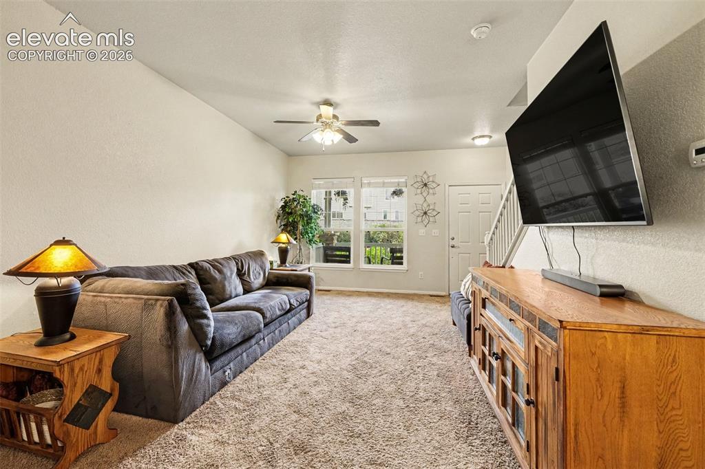 Image 5 of 24: View of living room from the dining area and kitchen