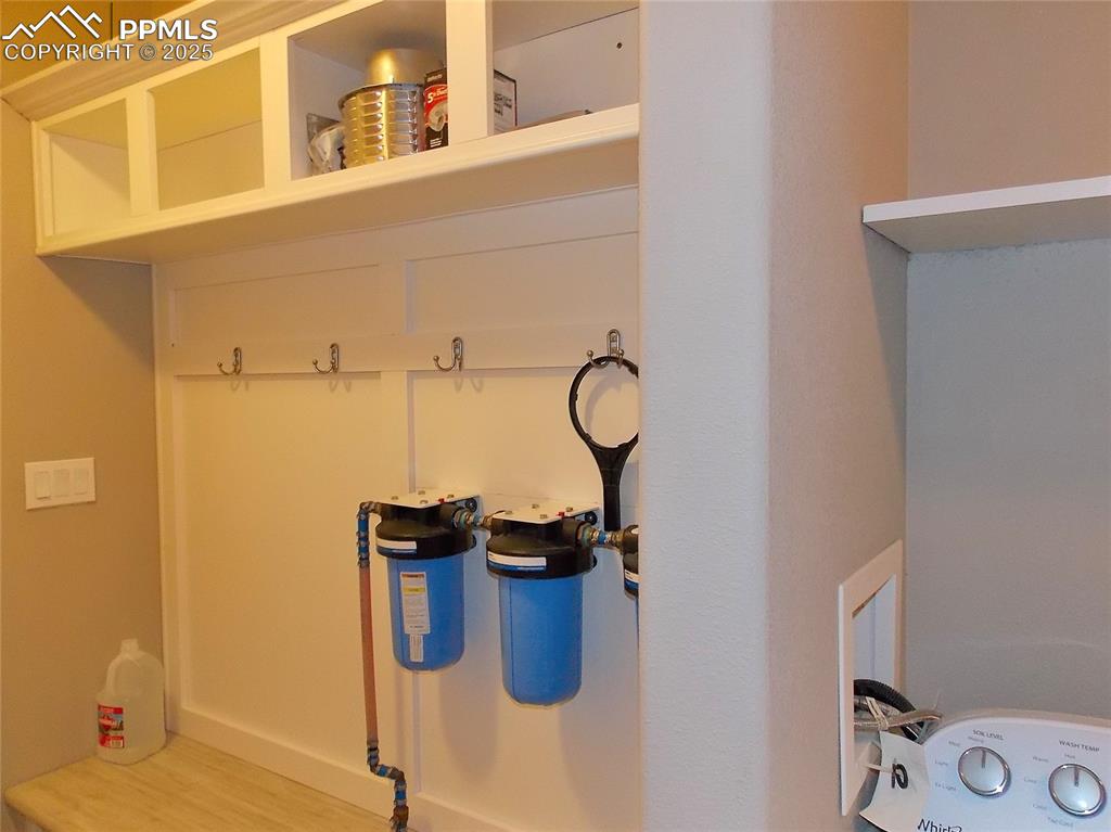 Image 24 of 33: Mudroom and water filter system