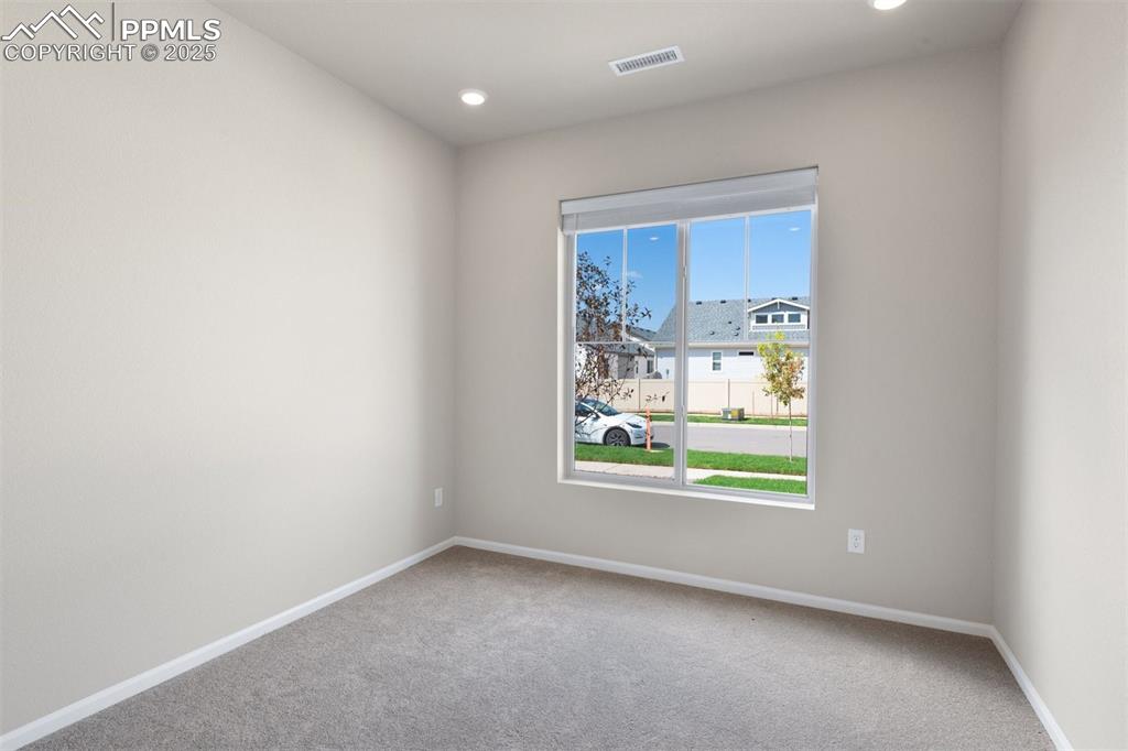 Image 28 of 28: Spare room featuring carpet and recessed lighting