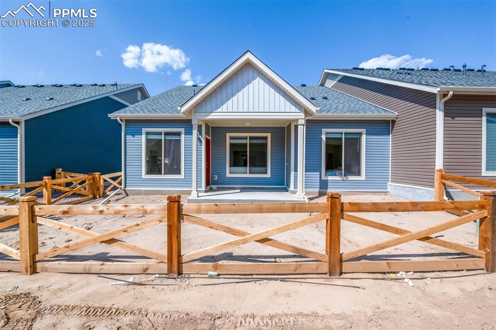 Image 7 of 28: View of front of property with roof with shingles, board and batten siding,