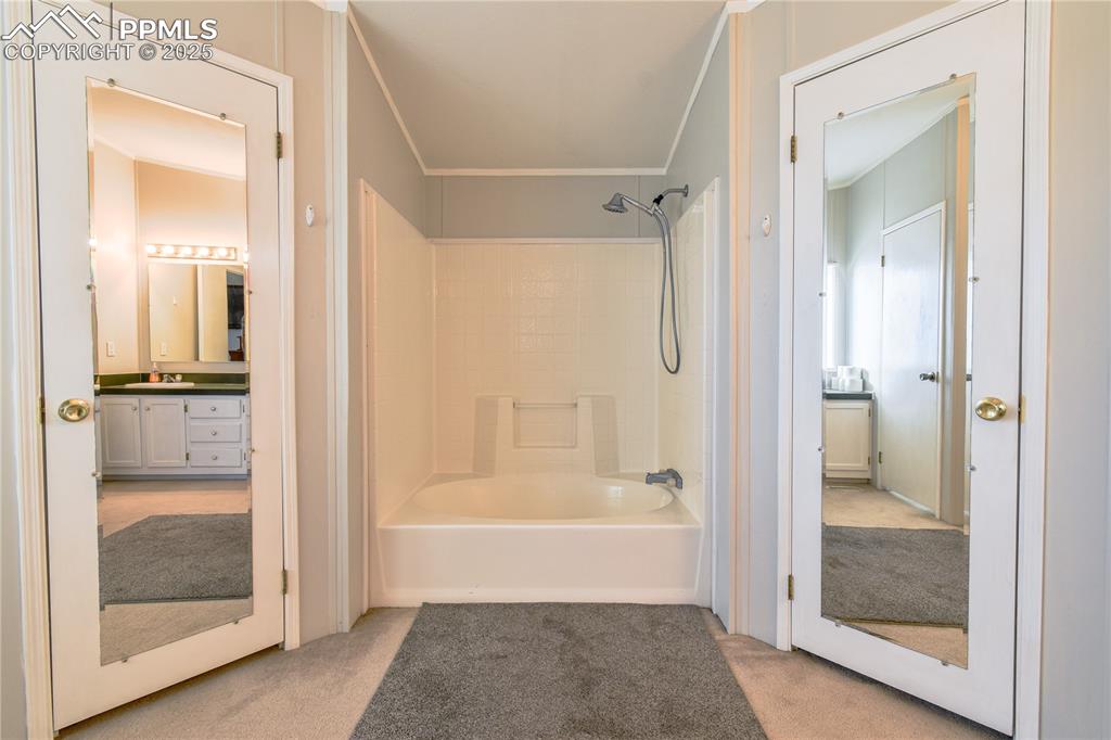 Image 29 of 34: Double walk in closets