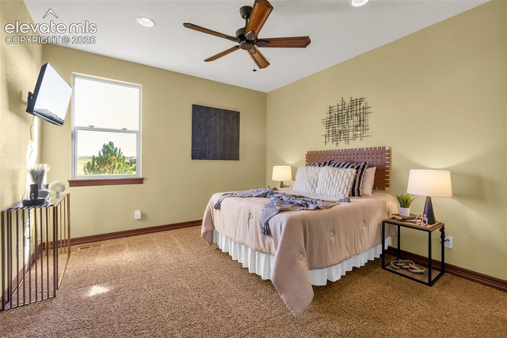 Image 42 of 50: Spacious room featuring neutral wall color, plush carpeting, recessed light