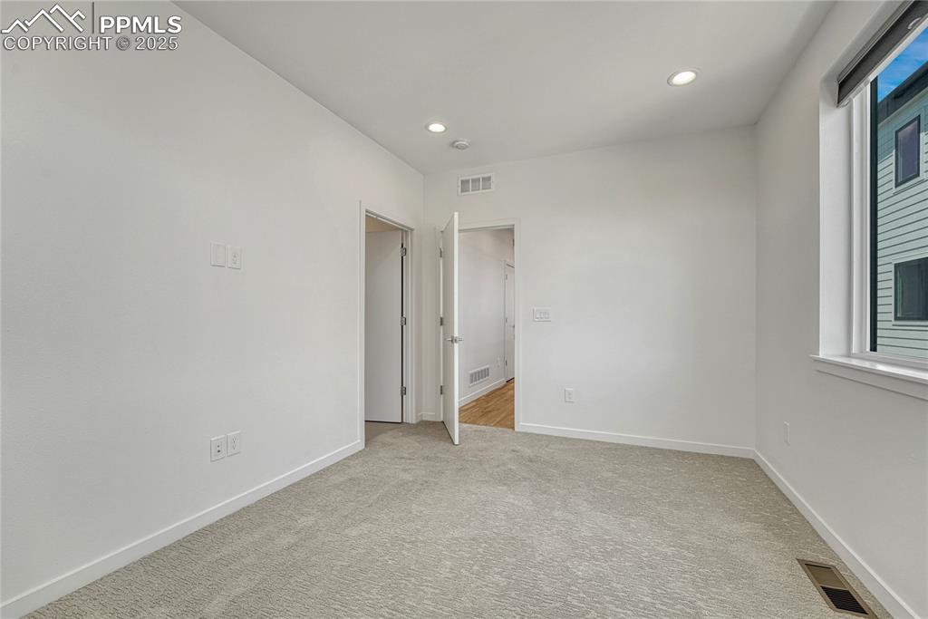 Image 21 of 49: Carpeted empty room featuring recessed lighting