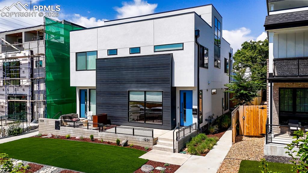 Image 45 of 49: Contemporary home with stucco siding