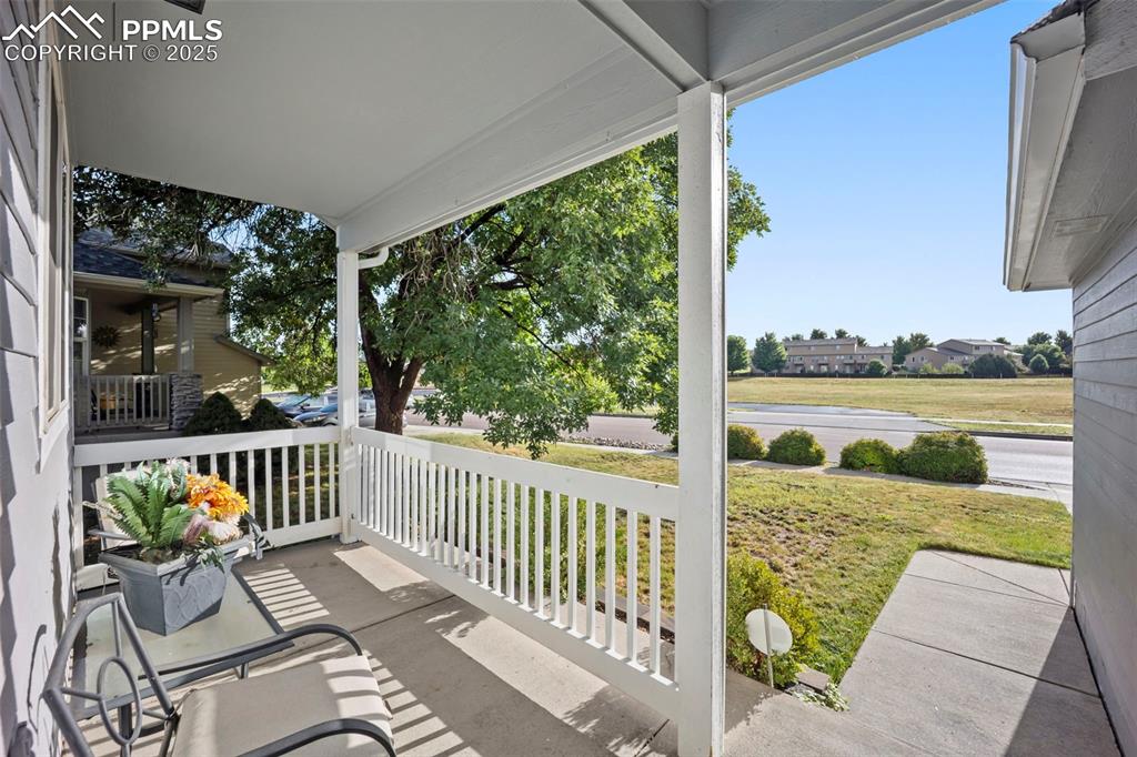 Image 4 of 50: Covered Front Porch with view of open space 