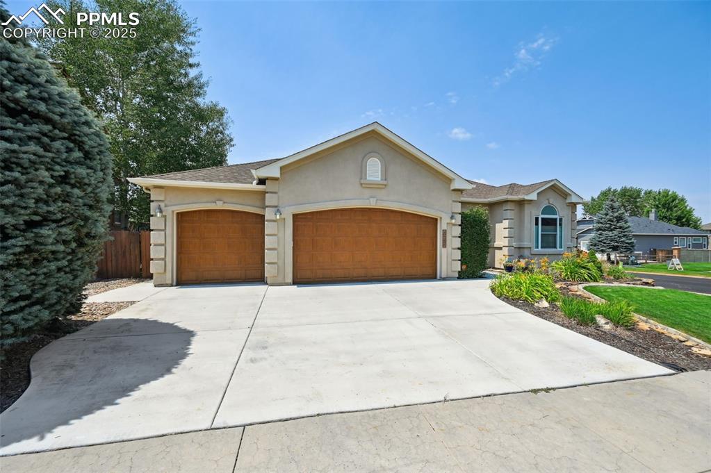 Image 2 of 45: Ranch-style house w/ 3 car garage 