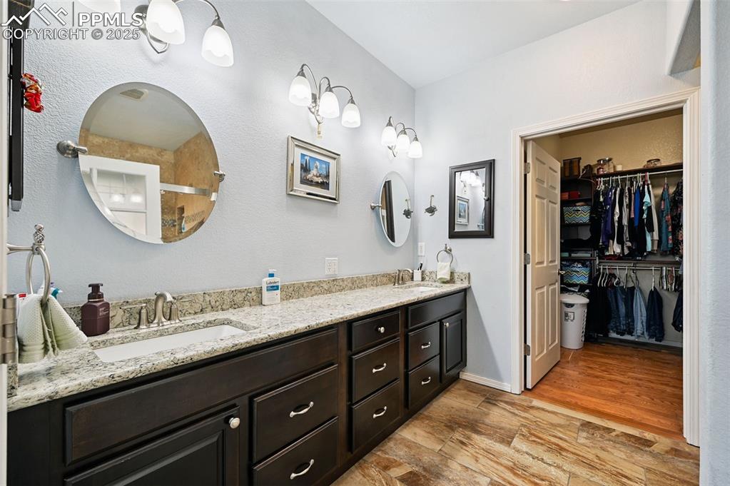 Image 23 of 45: primary bath with dual sinks 