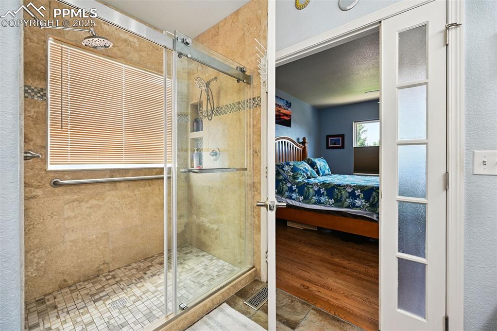 Image 24 of 45: walk in shower in primary bath 