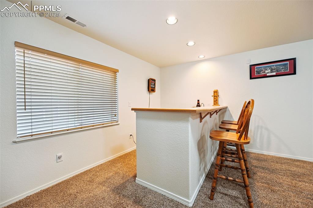 Image 26 of 45: Wet bar in basement 