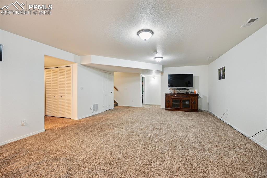 Image 28 of 45: Basement family room 