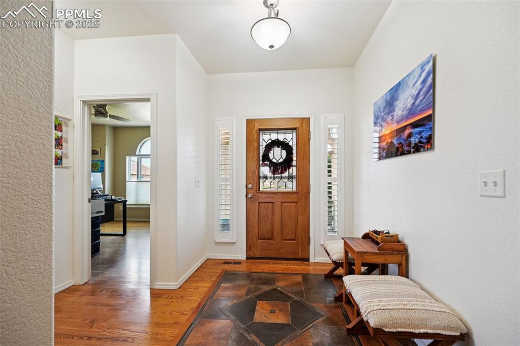 Image 7 of 45: Entryway with wood floors 