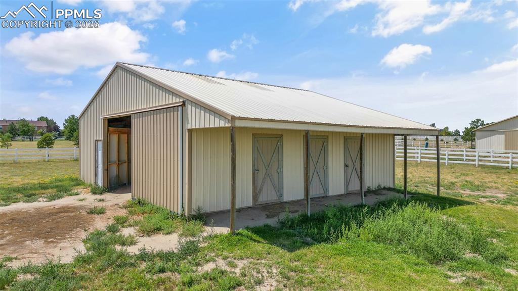 Image 2 of 47: View of outbuilding with an exterior structure