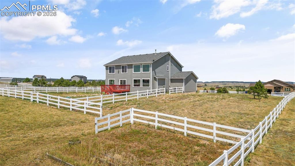 Image 38 of 47: View of front of house featuring an enclosed horse arena and a view of coun