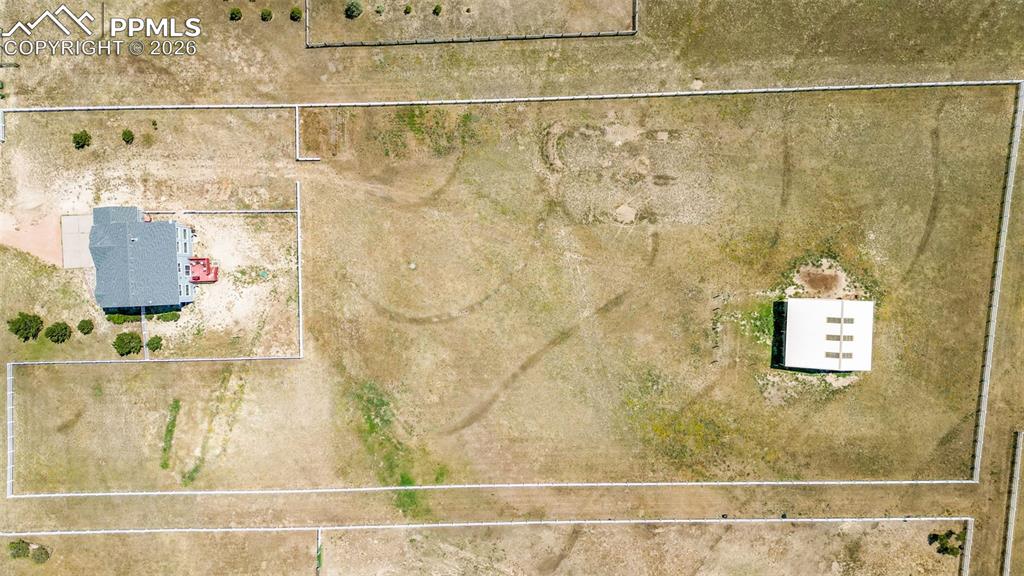 Image 43 of 47: Overview of rural landscape featuring property parcel outlined