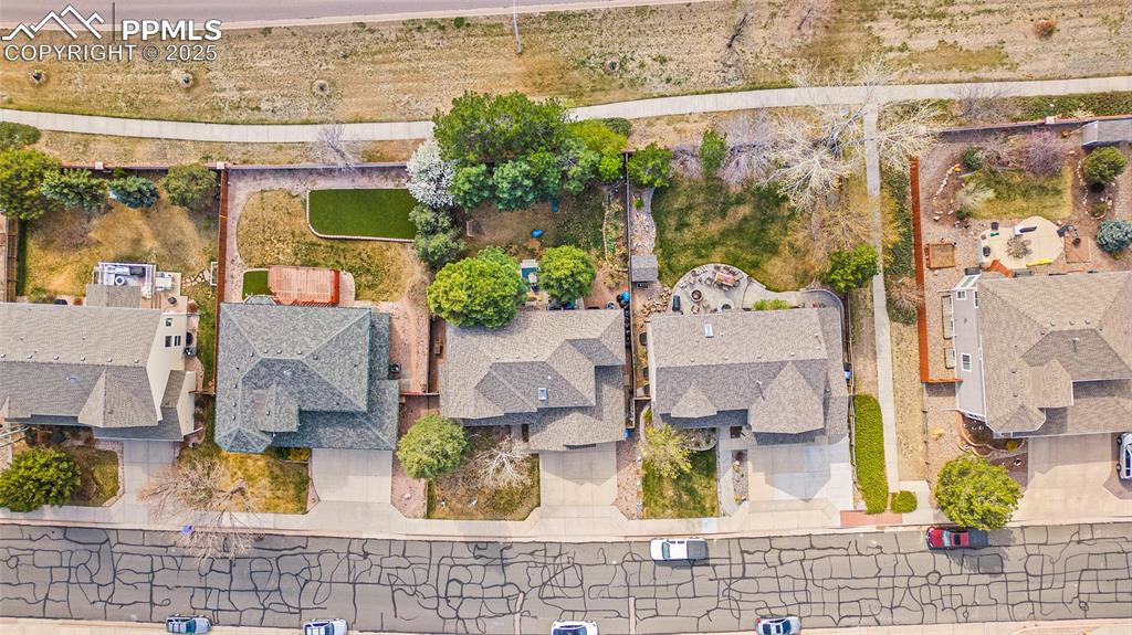 Image 34 of 35: Aerial view of property and surrounding area featuring mountains and nearby