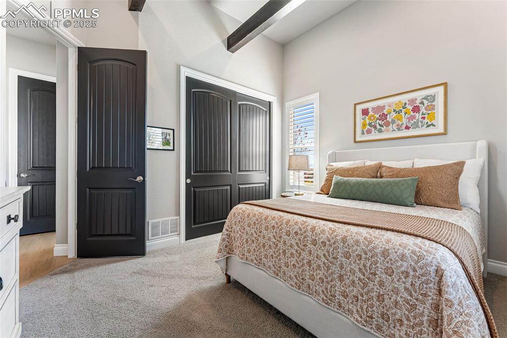 Image 28 of 50: This bedroom is just off the entry which allows for a separate and quiet pl