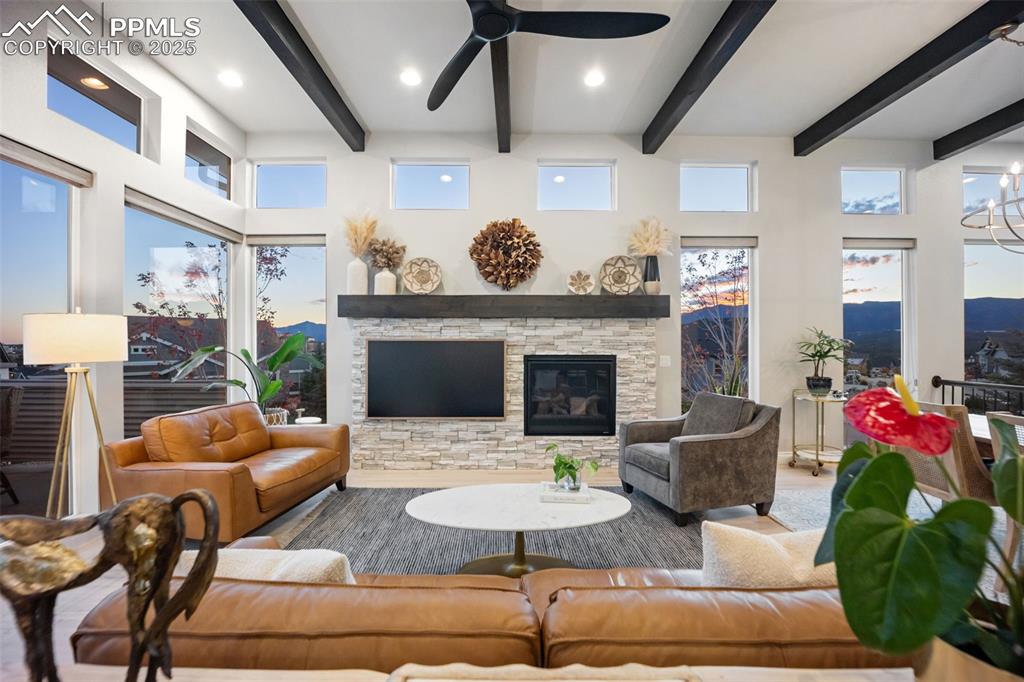 Image 3 of 50: Open layout main level with floor to ceiling windows to let in light and en