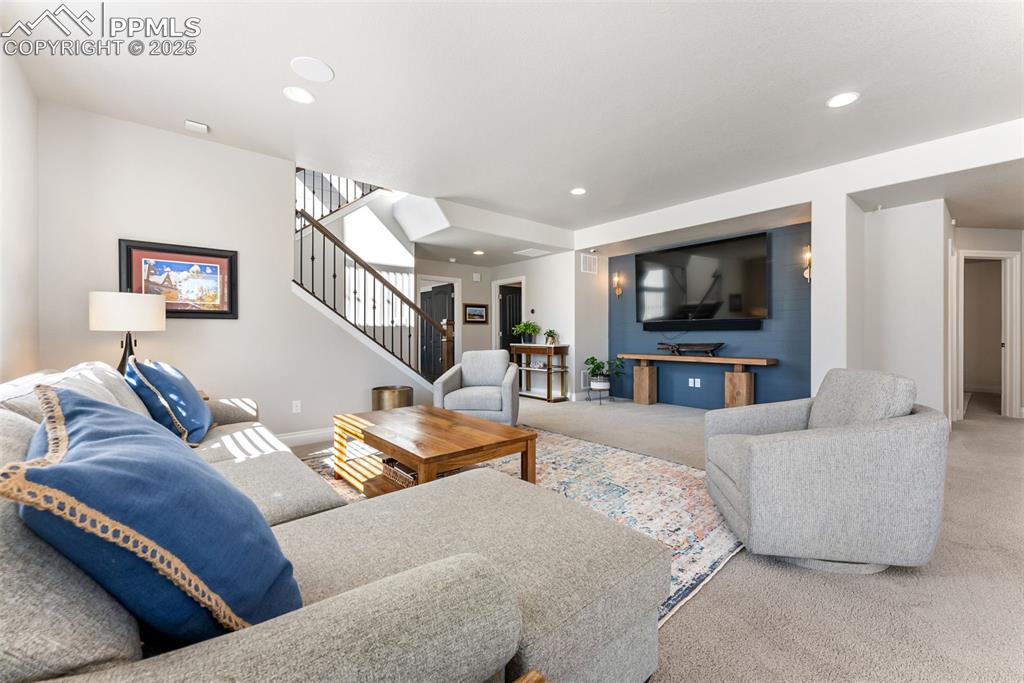 Image 33 of 50: The family room is a great space to entertain friends and family or relax w