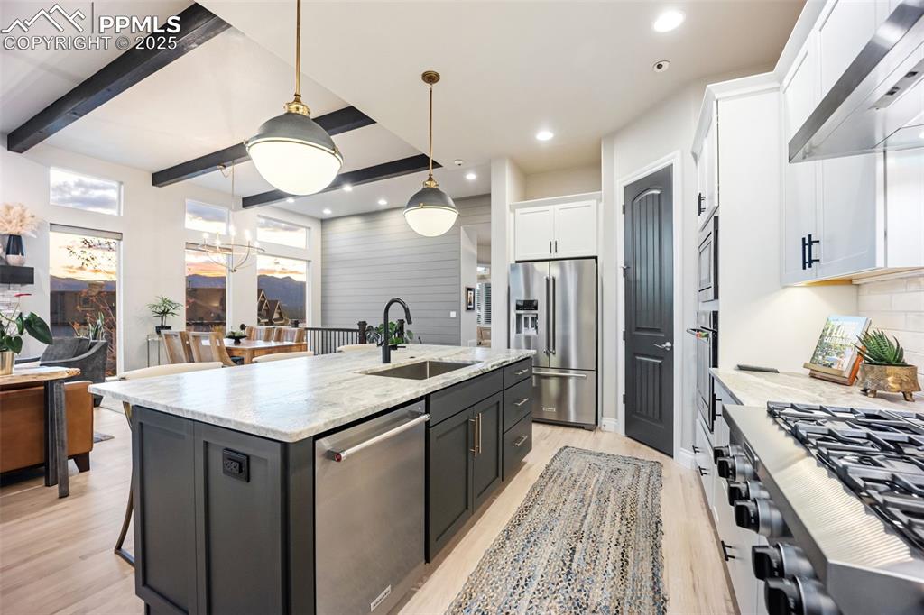 Image 4 of 50: Top of the line finishes and appliances like Fantasy Brown marble counterto