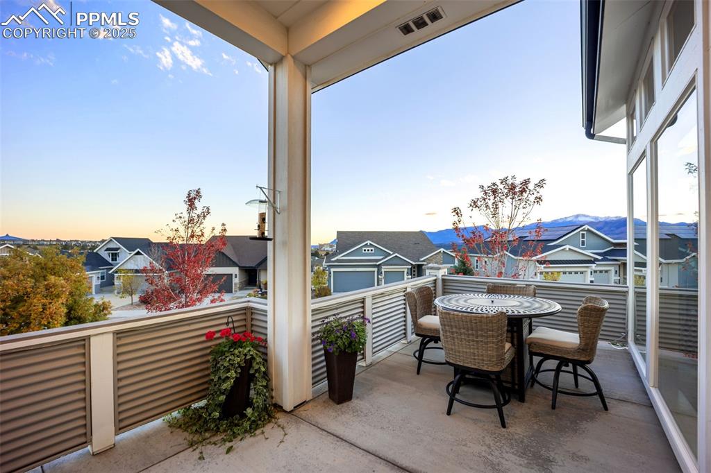 Image 9 of 50: The patio railing provides a sense of privacy from the sidewalks below whil