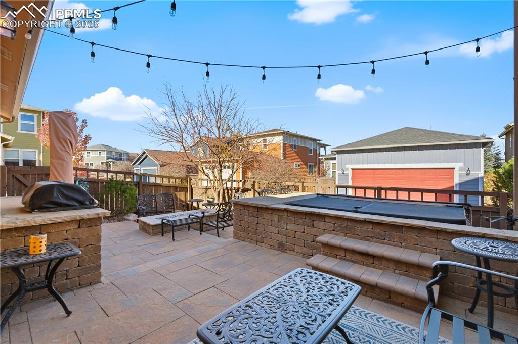 Image 37 of 42: Fenced backyard featuring a residential view, a fire pit, a patio, and exte