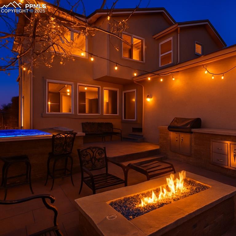 Image 39 of 42: View of patio featuring area for grilling