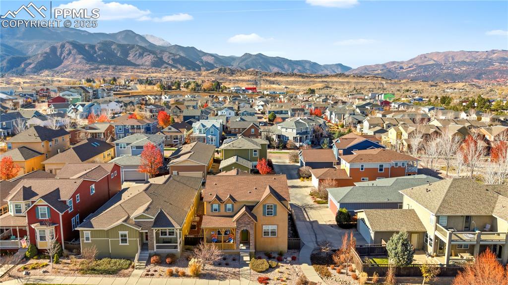 Image 41 of 42: Aerial perspective of suburban area with mountains