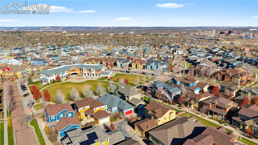 Image 42 of 42: Aerial view of property and surrounding area with nearby suburban area