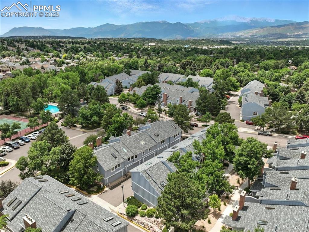 Image 23 of 25: Aerial view of residential area with mountains