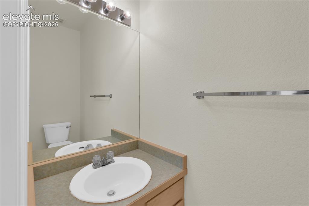 Image 19 of 30: Main level half bath