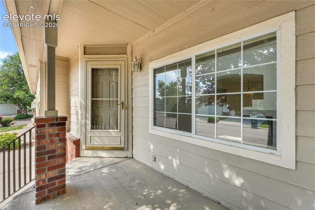 Image 21 of 30: Covered front porch