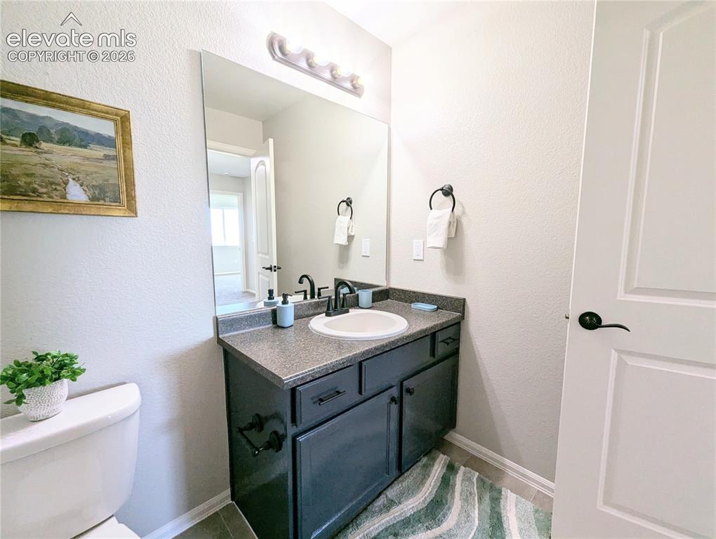 Image 38 of 49: Carpeted room featuring light-colored walls, white trim, and a white bi-fol