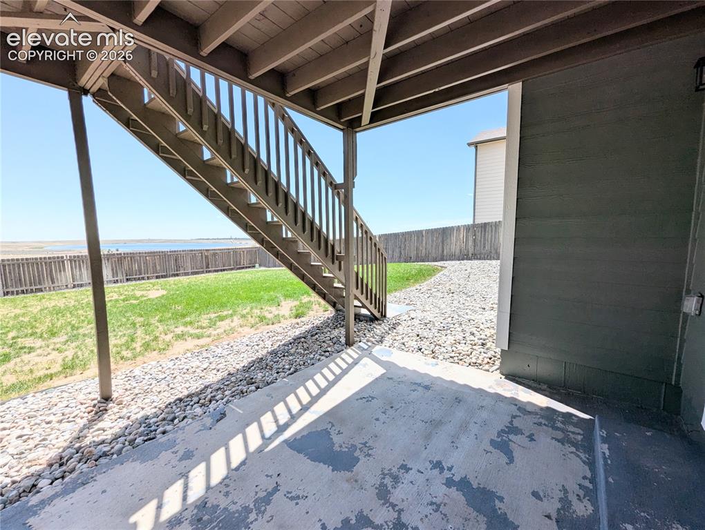 Image 46 of 49: Spacious interior featuring neutral wall paint, gray patterned carpet, and 