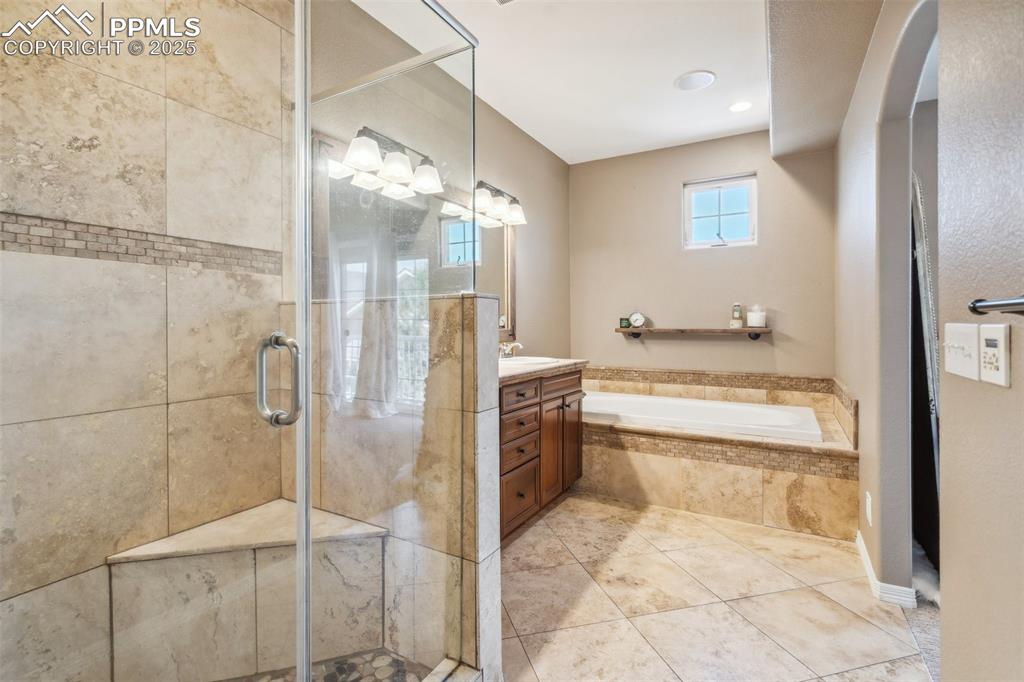 Image 21 of 49: Elegant Primary Master Bathoom