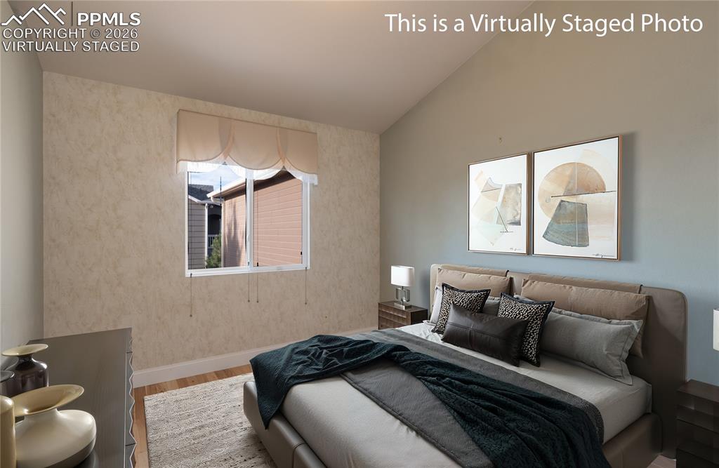 Image 18 of 50: Virtually Staged Photo - Main-level bedroom