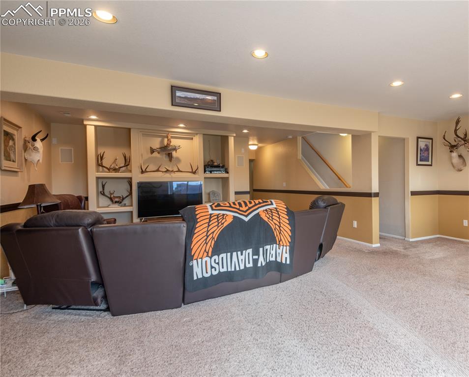 Image 26 of 50: Living/Family/Den room featuring carpet floors and recessed lighting, built