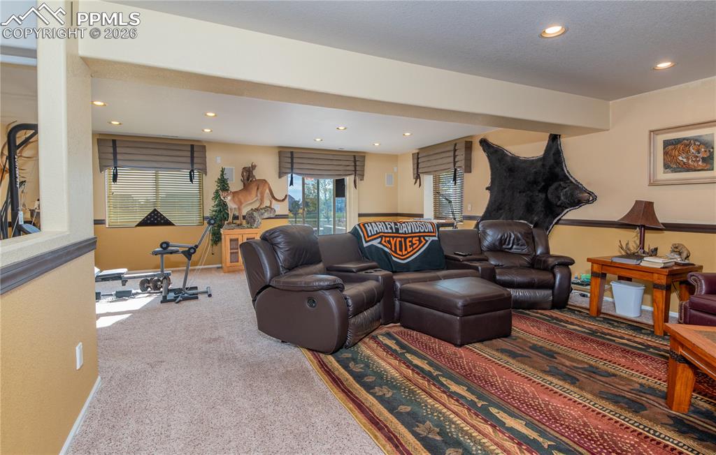 Image 28 of 50: Living/Family/Den room featuring carpet floors and recessed lighting, built