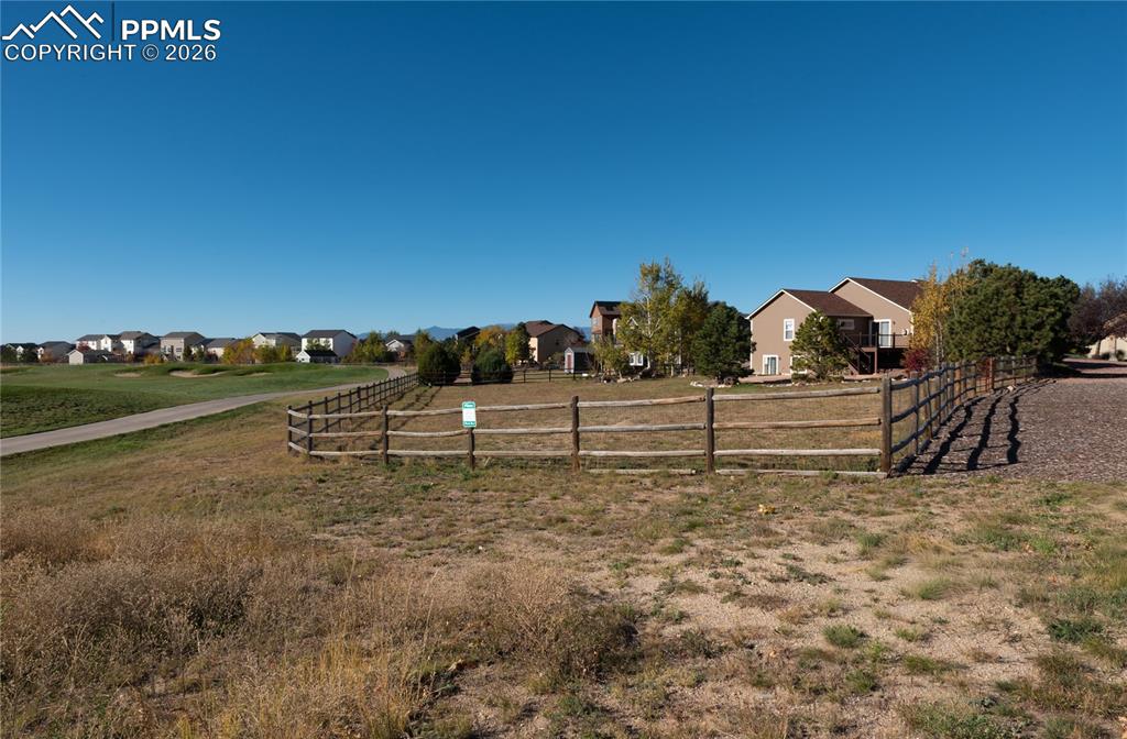 Image 42 of 50: View of backyard, backing to Antler Creek Golf Course