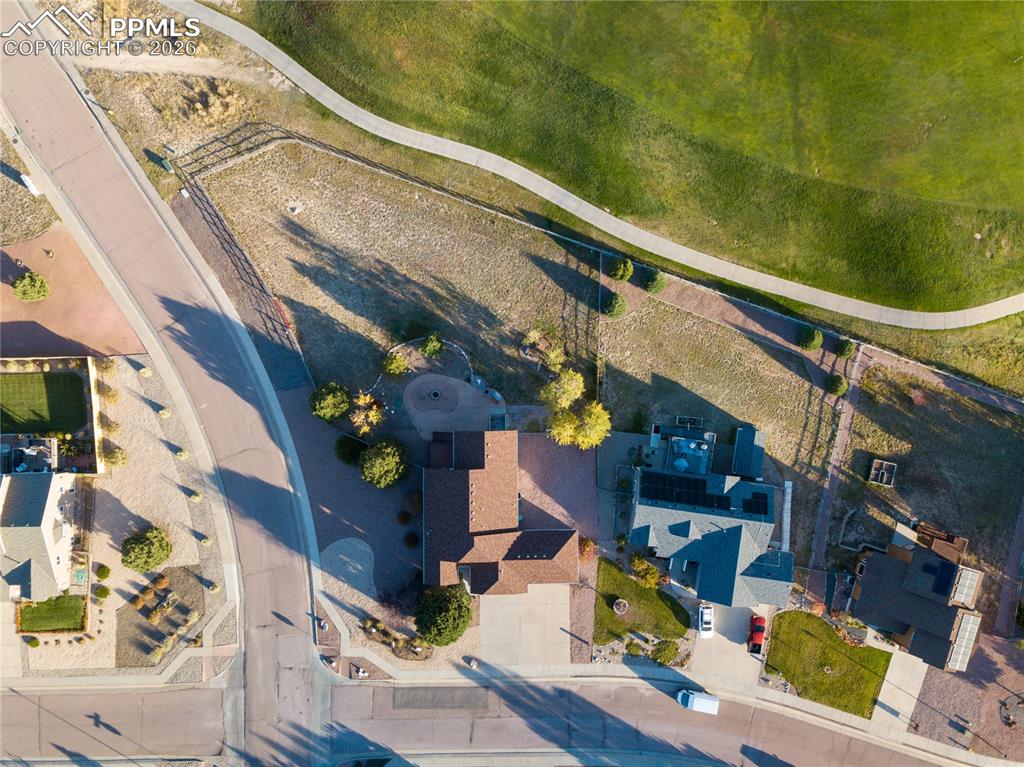 Image 49 of 50: Aerial/overhead view of home looking from the east featuring mountains and 