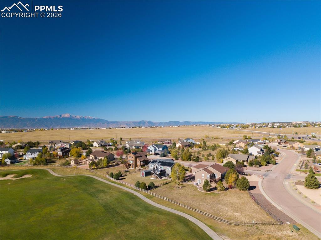 Image 50 of 50: Aerial view of home looking from the east featuring mountains and Antler Cr