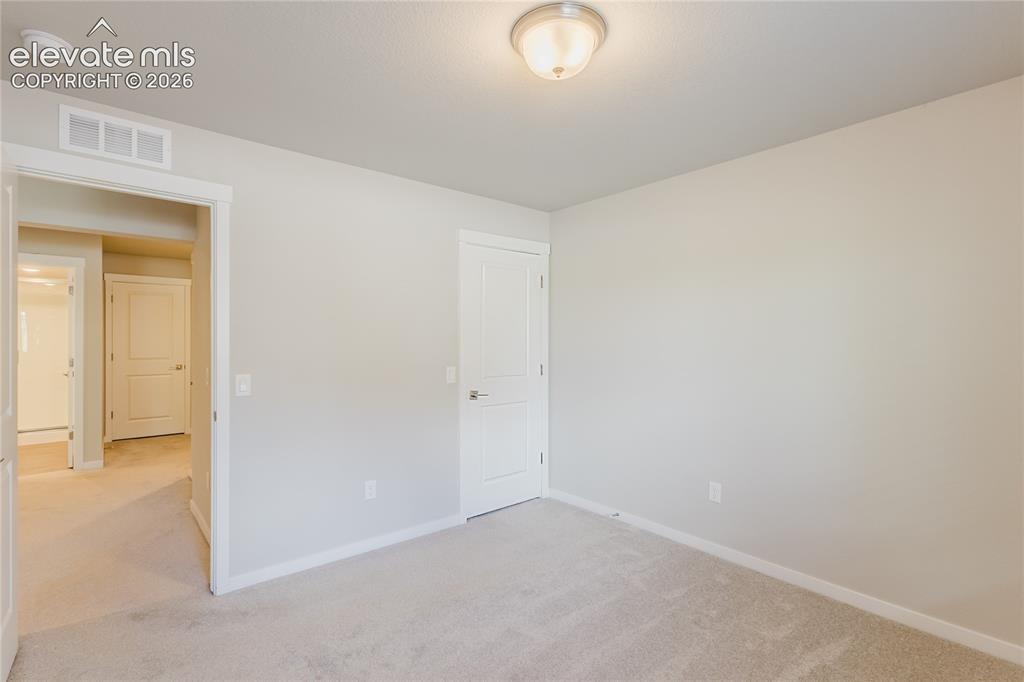 Image 13 of 21: Basement 4th Bedroom