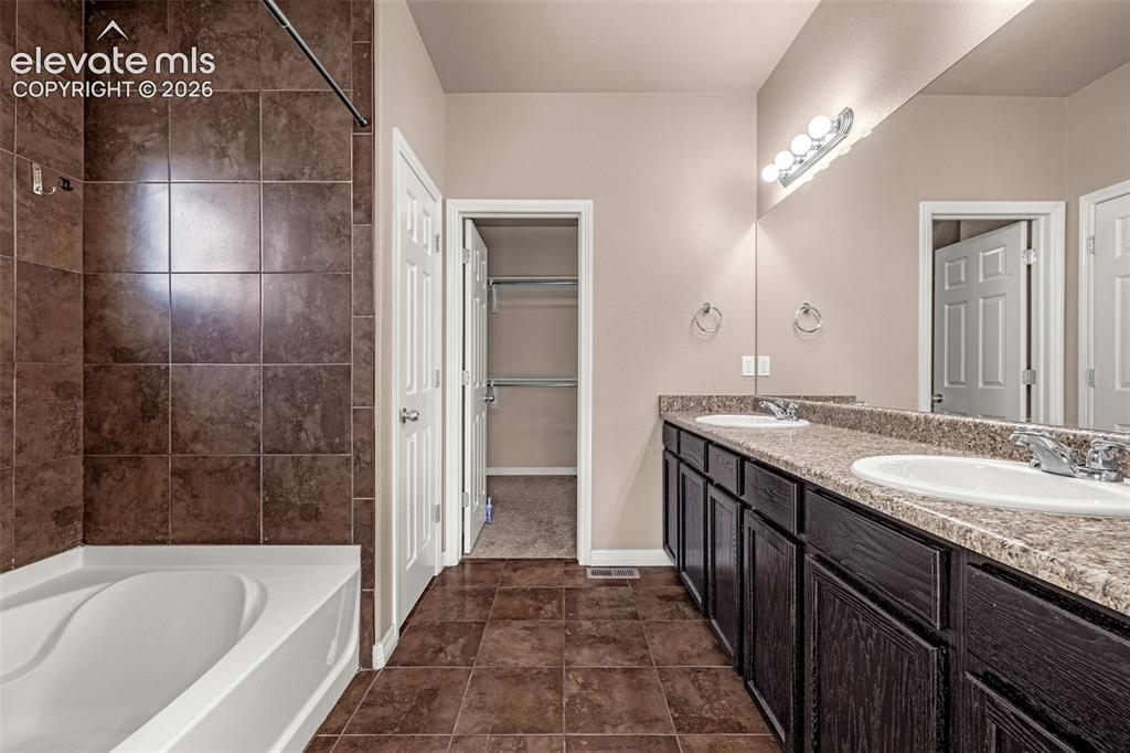 Image 13 of 39: Large walk-in closet ahead