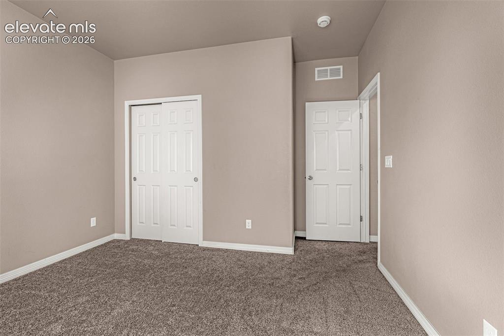 Image 19 of 39: 3rd bedroom - main level