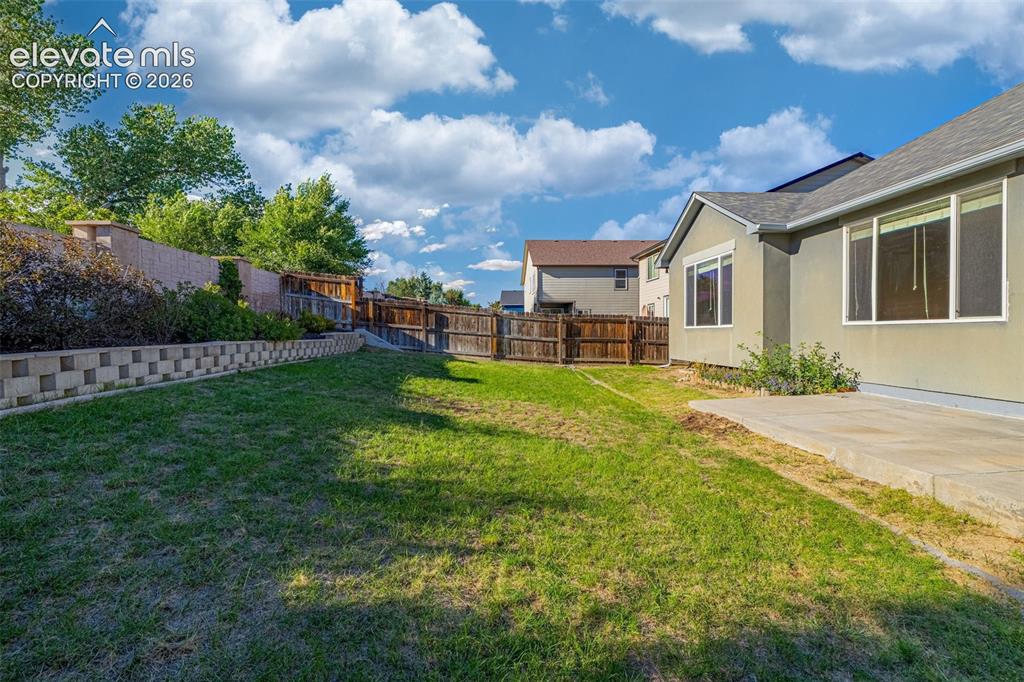 Image 6 of 39: Fully-fenced backyard