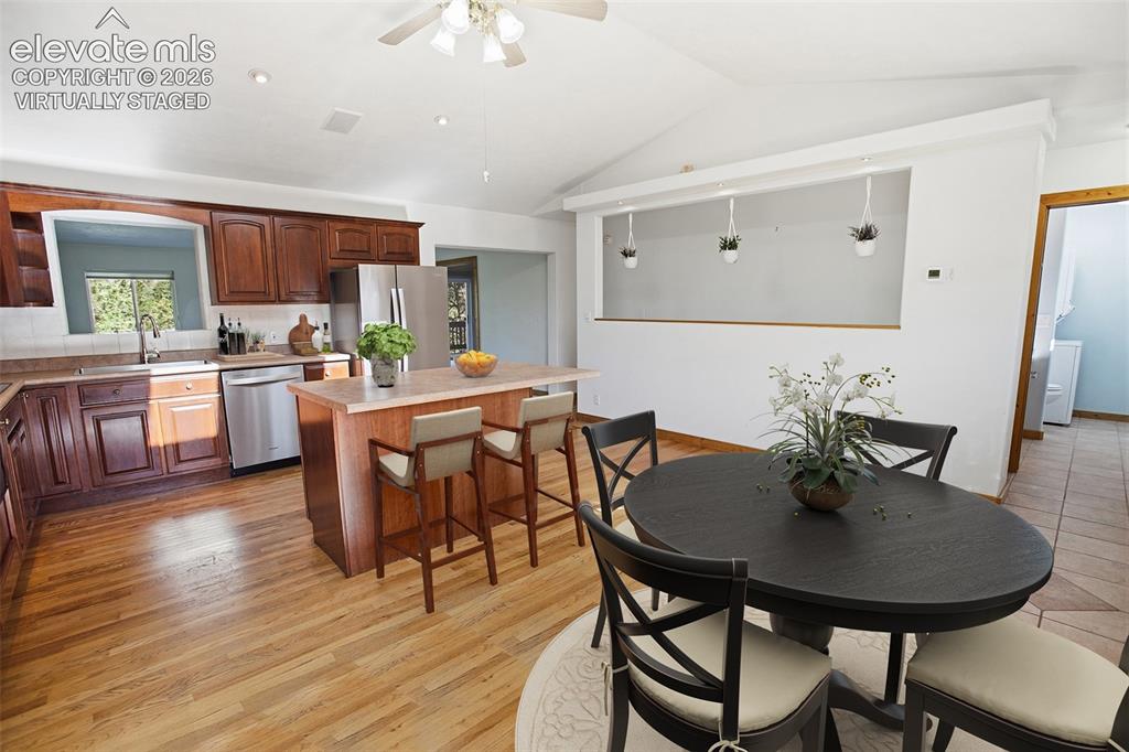 Image 8 of 42: Kitchen - Dining - Virtually Staged