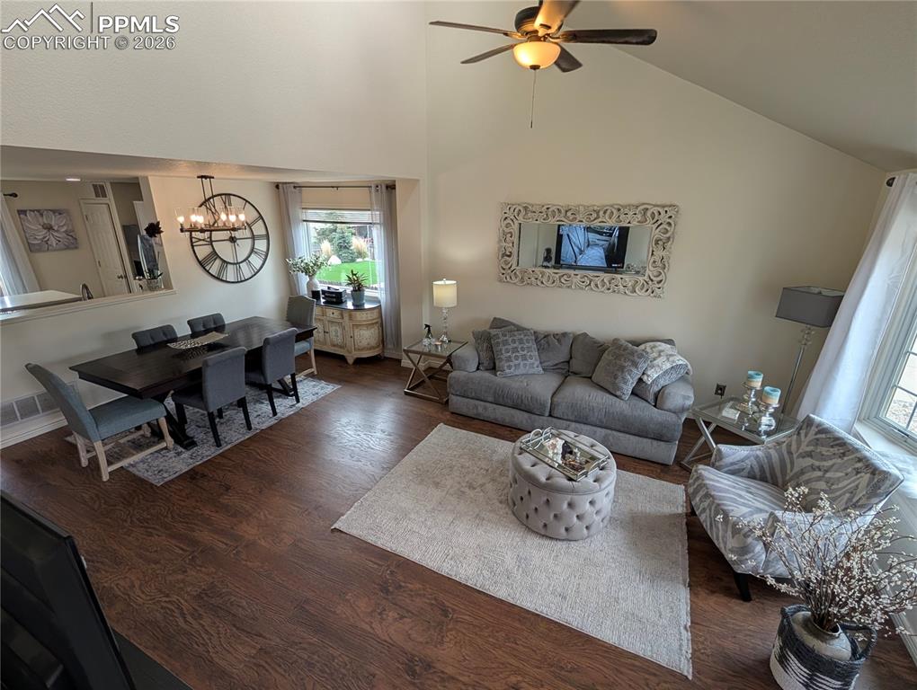 Image 2 of 30: great room with wood laminate floors
