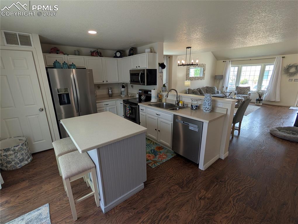 Image 8 of 30: kitchen island with breakfast bar