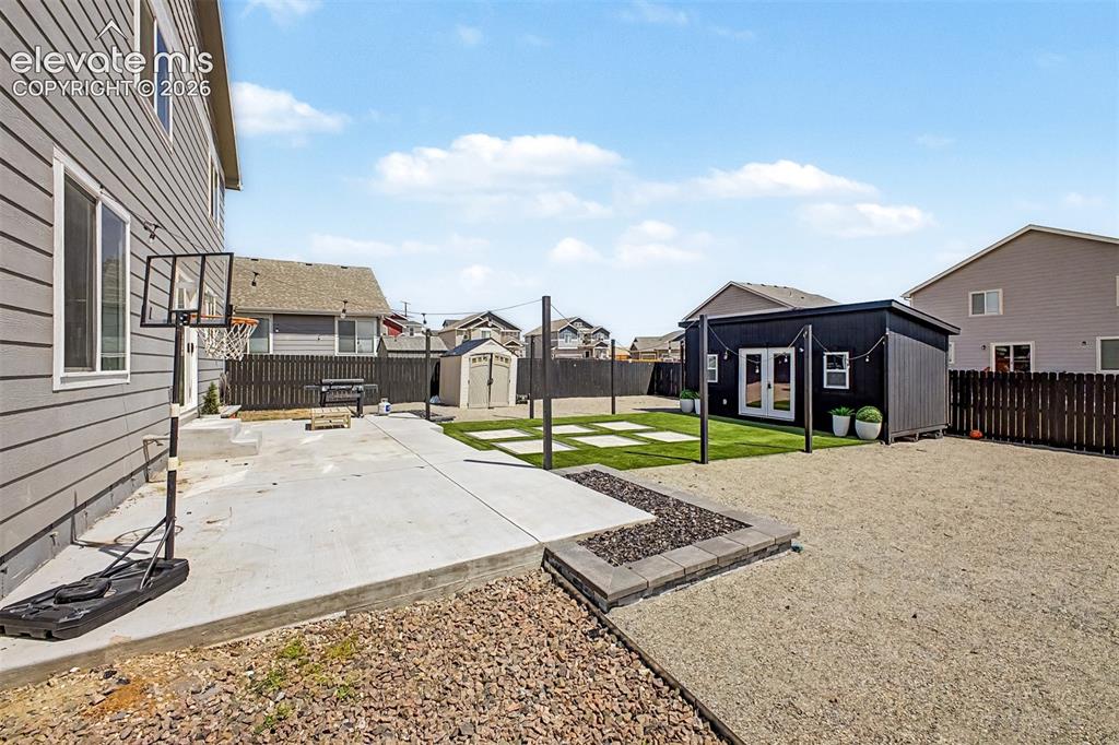 Image 15 of 39: Professionally Landscaped Backyard
