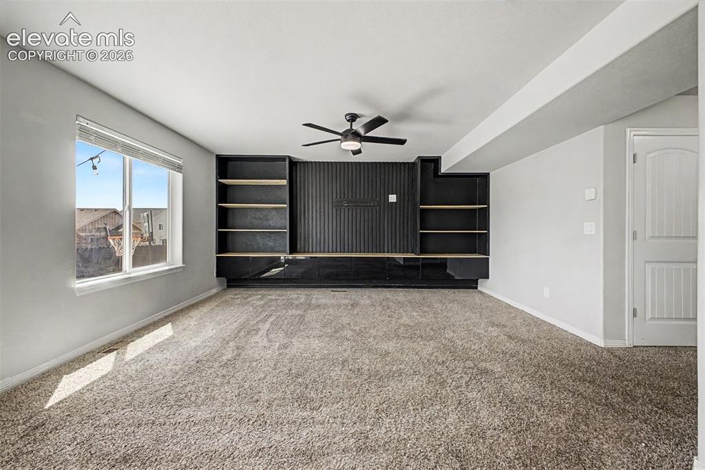 Image 17 of 39: Custom Wall feature with built in cabinets